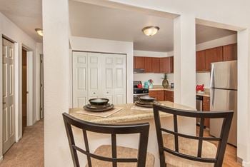 Light cabinets and a breakfast bar make this a nice spot to sit and socialize